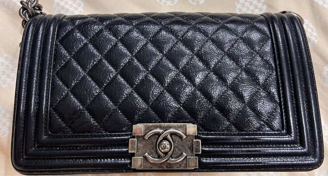 Black Patent Chanel Boy (Old Medium), Shoulder Bag (Category: Bags & Wallets) located in Singapore. Submitted by helloclearance (Listing ID 1366840029, Image 2). Description: 💯 authentic. Full set with box but no receipt. Authenticity card available. Very soft patent black with gun metal hardware. Keen pls pm. Slight negotiation can be discussed for this beautiful bag 🌟 .