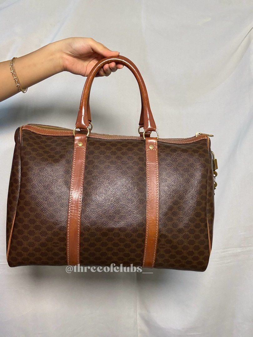 Celine Macadam Canvas Boston Travel Bag (Category: Luxury Bags & Wallets) located in Quezon City. Submitted by threeofclubs__ (Listing ID 1367481139, Image 3). Description: Very good condition rank ab Clean exterior and interior No major cracks Normal signs of wear With lock & keys and dustbag inclusion ♣ Disclaimer: The products showcased in this shop are not affiliated with or endorsed by any specific brand, manufacturer, or organization. All r