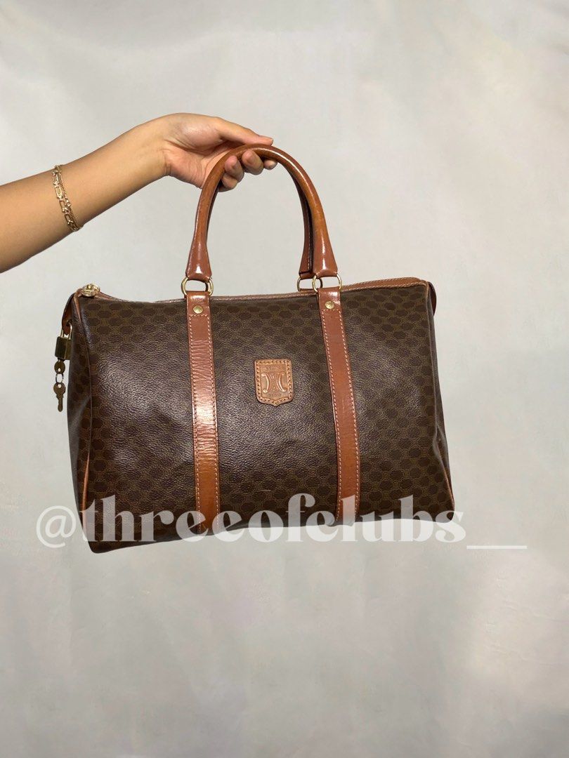 Celine Macadam Canvas Boston Travel Bag (Category: Luxury Bags & Wallets) located in Quezon City. Submitted by threeofclubs__ (Listing ID 1367481139, Image 1). Description: Very good condition rank ab Clean exterior and interior No major cracks Normal signs of wear With lock & keys and dustbag inclusion ♣ Disclaimer: The products showcased in this shop are not affiliated with or endorsed by any specific brand, manufacturer, or organization. All r