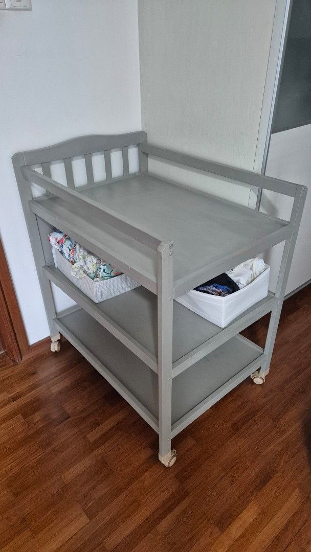 Changing table (Category: Changing Tables & Stations) located in Singapore. Submitted by aleksandranna (Listing ID 1367429351, Image 1). Description: changing table with lots of storage, on the wheels, but you can also block them. We'll used but in good condition, except for one dent (check pics) no other visible scratches, and this one will be covered by changing mat anyway. self pick up near Beauty World.