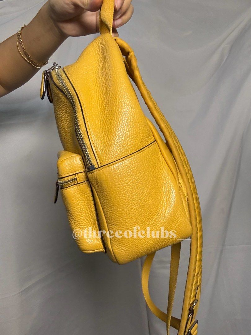 Coach Mini Charlie Yellow Backpack (Category: Luxury Bags & Wallets) located in Quezon City. Submitted by threeofclubs__ (Listing ID 1367480388, Image 3). Description: Excellent-very good condition Clean exterior and interior Double check photos for normal signs of usage No cracks on leather Adjustable strap ♣ Disclaimer: The products showcased in this shop are not affiliated with or endorsed by any specific brand, manufacturer, or organization. 