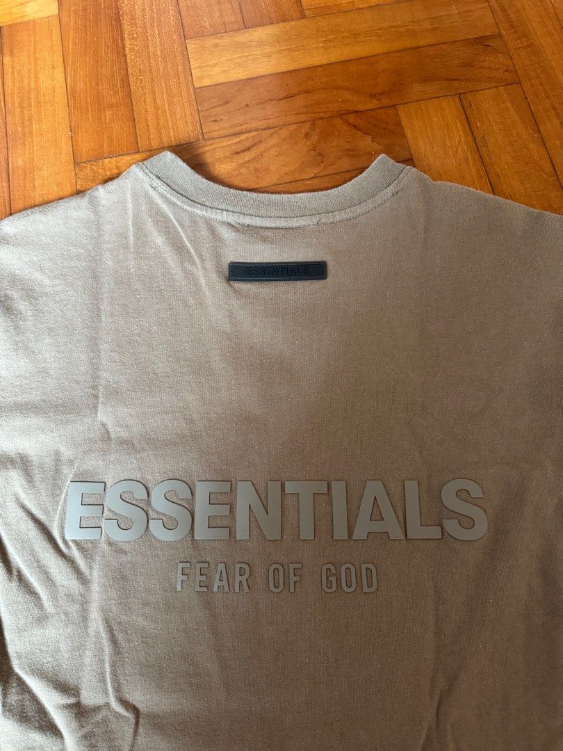 Essentials tee (Category: Tshirts & Polo Shirts) located in Singapore. Submitted by stealsz (Listing ID 1367373389, Image 3). Description: 100% authentic bought from Heat SG There are some bleach stains, other than that the tee has no flaws :) .