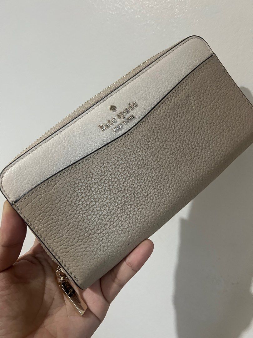 Kate Spade Large Continental Wallet (Category: Luxury Bags & Wallets) located in Quezon City. Submitted by nugssells (Listing ID 1367321862, Image 1). Description: ‼️ FINAL PRICE POSTED – NO HAGGLING. LOW BALLERS WILL BE IGNORED. ‼️ - 100% ORIGINAL FROM THE US - Selling for my family - Barely used, still in good condition - Small dent in front due to storage but overall condition is great pa. No stains or other flaws.