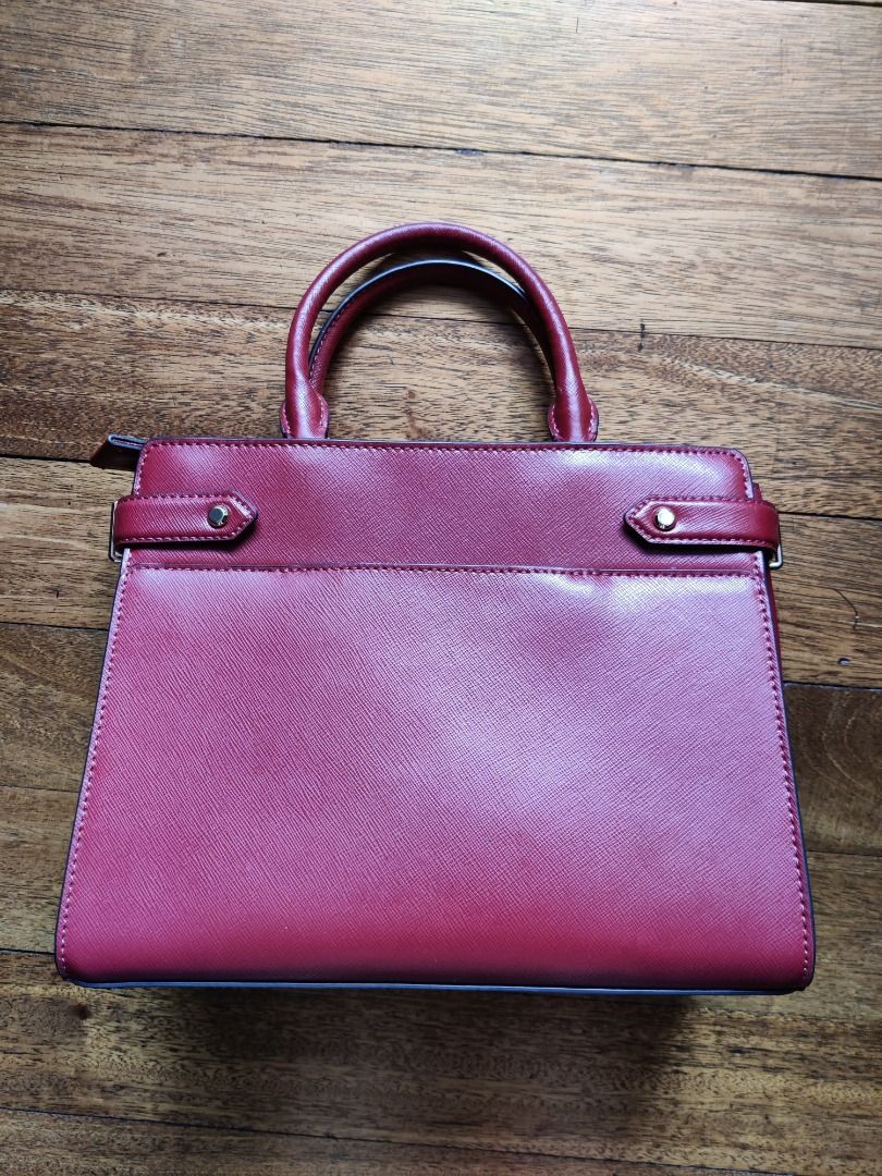 ORIGINAL KATE SPADE STACI MEDIUM SATCHEL (Category: Luxury Bags & Wallets) located in Marikina City. Submitted by gimo17 (Listing ID 1367426025, Image 3). Description: Color: Red Currant and Light Gold Metal Material: Saffiano Calf Leather RFS: Decluttering Description: -in very good condition, used only twice (9/10) -has front and back exterior slip pockets -can be a handbag or crossbody bag (detachable crossbody strap-never been used).