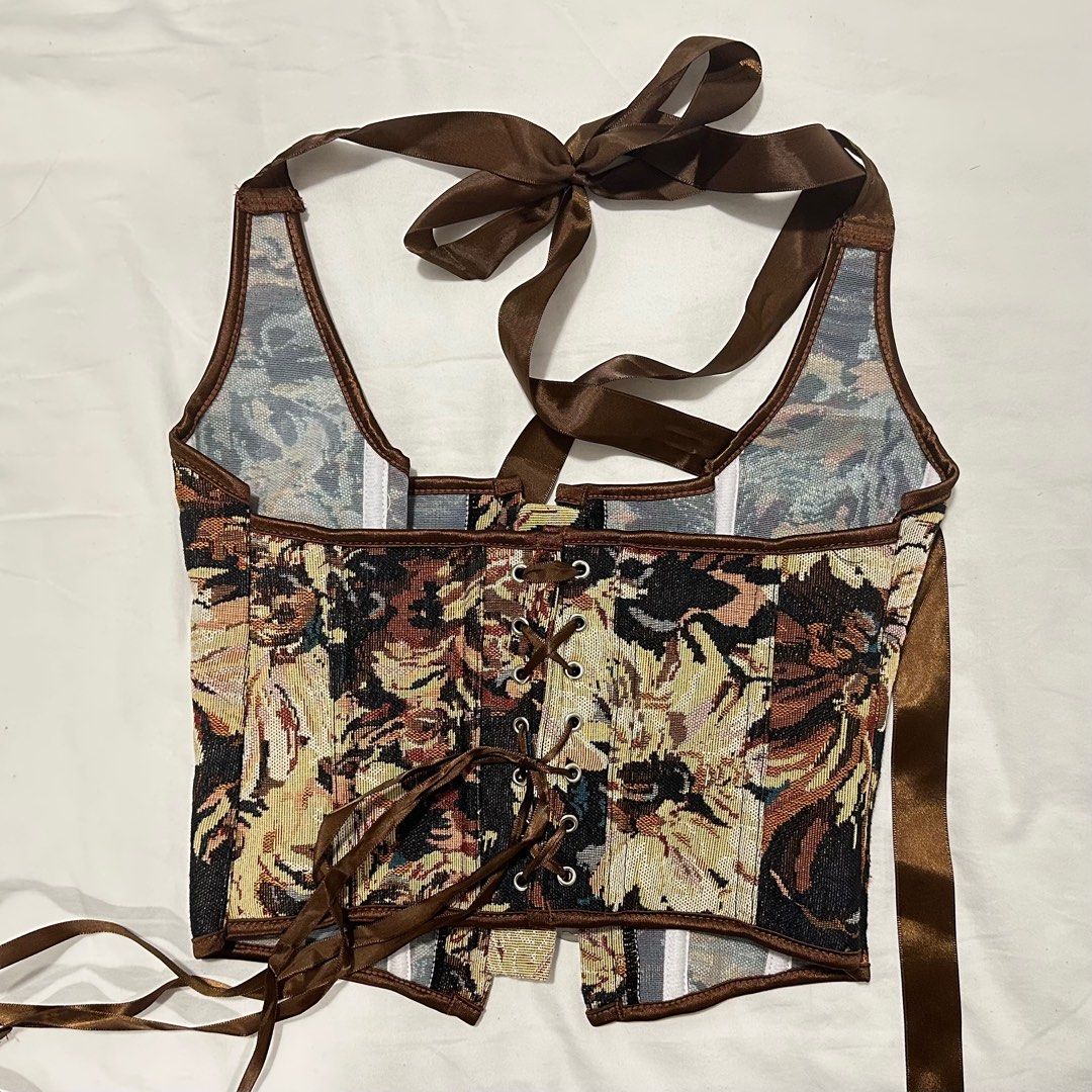 patterned corset (Category: Other Tops) located in Kuala Lumpur. Submitted by somos.amanos (Listing ID 1367478650, Image 3). Description: brown patterned thick fabric corset halter tie worn once front hooks, lace back has been tailored to make smaller but can be undone.