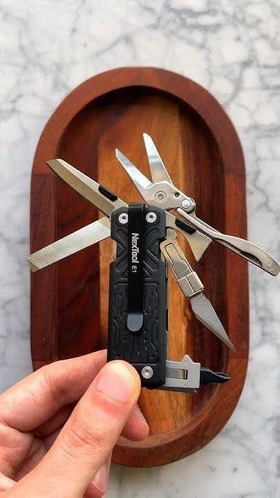 Nextool E1 Multi-Function Pocket Tool (Category: Hiking & Camping) located in Singapore. Submitted by macro_electronic (Listing ID 1367624588, Image 1). Description: << REVIEW VIDEO >> https://www.youtube.com/watch?v=7lxhjdmh644 << KEY FEATURES >> ✅ 10 practical tools in a compact form factor that fit your pocket perfectly; ✅ Patented large scissor with spring loaded for greater cutting power; ✅ Utility knife with replaceable blade; ✅ Convenient 