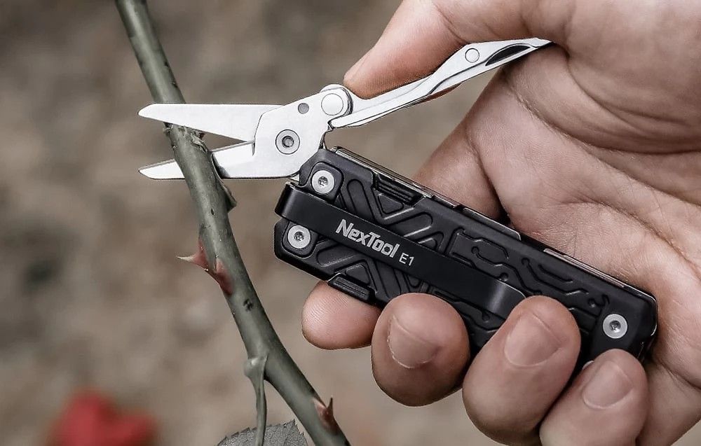Nextool E1 Multi-Function Pocket Tool (Category: Hiking & Camping) located in Singapore. Submitted by macro_electronic (Listing ID 1367624588, Image 2). Description: << REVIEW VIDEO >> https://www.youtube.com/watch?v=7lxhjdmh644 << KEY FEATURES >> ✅ 10 practical tools in a compact form factor that fit your pocket perfectly; ✅ Patented large scissor with spring loaded for greater cutting power; ✅ Utility knife with replaceable blade; ✅ Convenient 