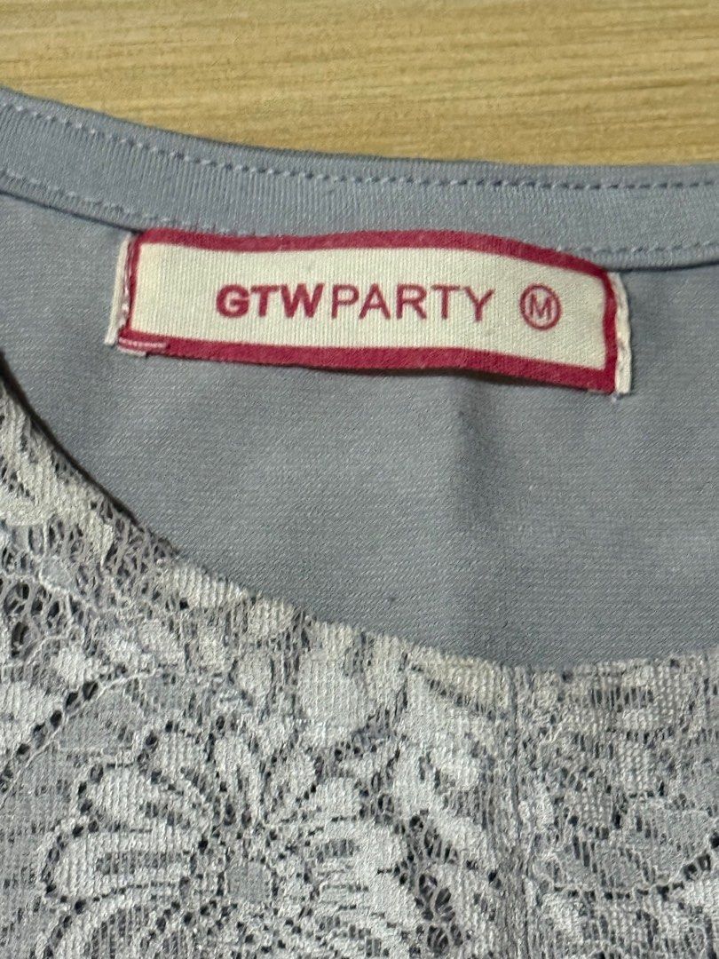 Gray Lace Floral Blouse (Category: Blouses) located in Quezon City. Submitted by corncarts (Listing ID 1367536430, Image 3). Description: Brand: GTW Party M on tag floral see-through fabric on front, stretchable fabric on back Bust - 36 Length - 19.