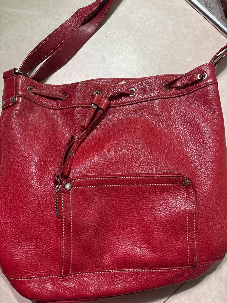 Longchamp red leather bag (Category: Bags & Wallets) located in Singapore. Submitted by unicorninini (Listing ID 1367648448, Image 1). Description: Well used red leather .