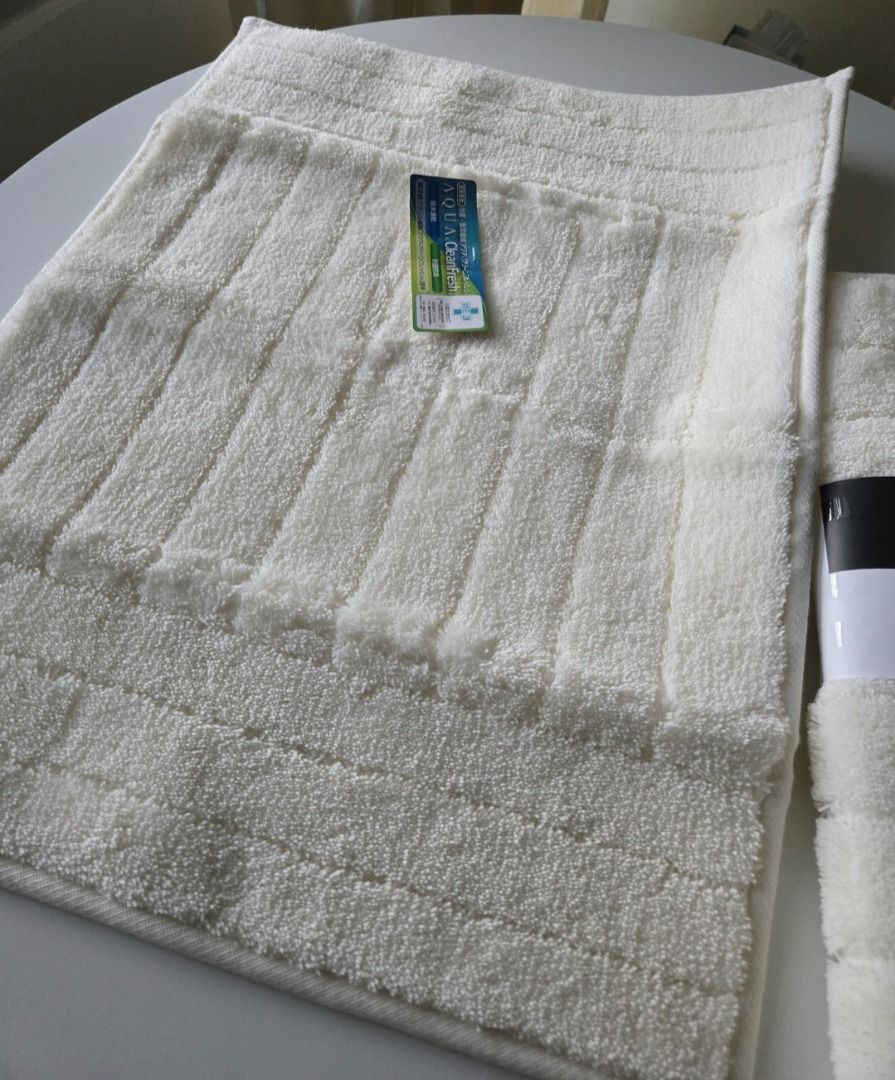 NITORI White Bath Mat 45 x 60 cm (Category: Bathroom & Kitchen Fixtures) located in Pasig City. Submitted by aya-2025 (Listing ID 1367557324, Image 2). Description: Material: Made with Toyobo acrylic fiber for cleanliness and comfort. Size: 45 x 60 cm (17.7 x 23.6 inches). Features: Highly absorbent and quick-drying. Antibacterial and odor-resistant. Soft and comfortable to step on. Care: Machine washable with a net. Brand: Nitori. Original price