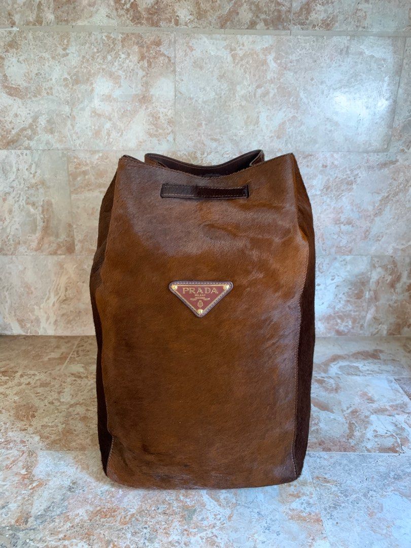 Prada Drawstring bagpack (Category: Luxury Bags & Wallets) located in Baguio. Submitted by 2600ave. (Listing ID 1367572958, Image 1). Description: Original Prada Drawstring Bagpack ✨ Superb! Ang ganda po nito ❤️ No issues Excellent Condition Asking price: 23,000 Negotiable.