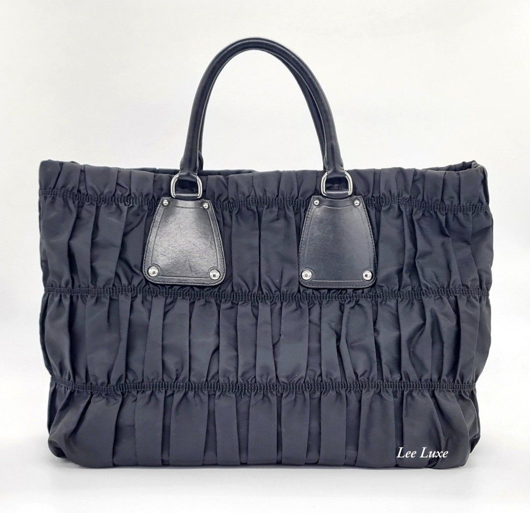 Prada Tessuto Gauffre Bag (Category: Luxury Bags & Wallets) located in Paranaque City. Submitted by jlee_closet (Listing ID 1367528962, Image 3). Description: authentic Prada tessuto gauffre bag in pristine condition. the perfect bag for work, school, or daily use. spacious enough and super light weight! meet ups okay.