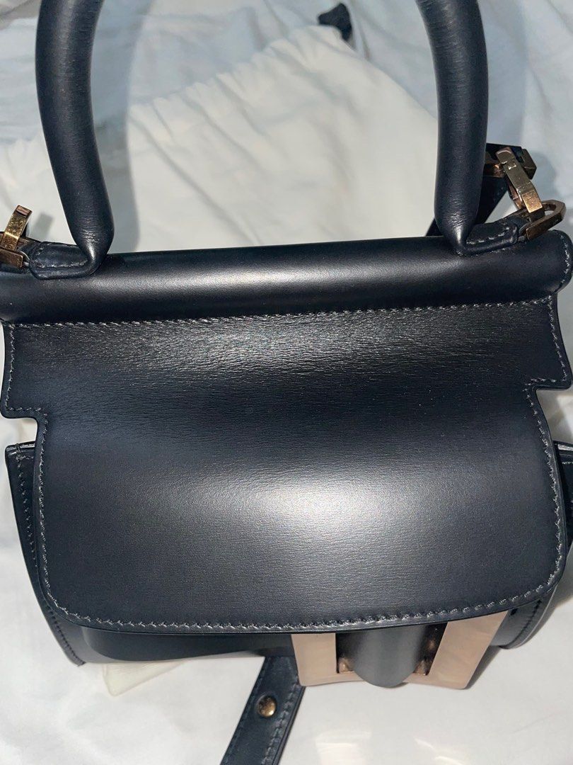 Authentic Boyy Karl 19 Black Bag (Category: Luxury Bags & Wallets) located in Quezon City. Submitted by breakmyfashion (Listing ID 1367758893, Image 2). Description: Material: Palmellato Calfskin Calfskin suede lining in ginger color. Black edge paint. Oversized metal buckle and leather belt. with single carry handle. Front flap closure. Inside zipper pocket and pouch. Adjustable and detachable leather shoulder strap. Metal feet at base. Comes wi