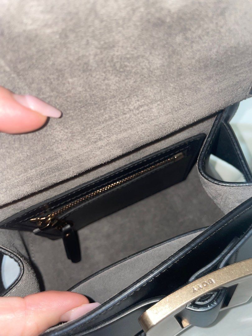 Authentic Boyy Karl 19 Black Bag (Category: Luxury Bags & Wallets) located in Quezon City. Submitted by breakmyfashion (Listing ID 1367758893, Image 3). Description: Material: Palmellato Calfskin Calfskin suede lining in ginger color. Black edge paint. Oversized metal buckle and leather belt. with single carry handle. Front flap closure. Inside zipper pocket and pouch. Adjustable and detachable leather shoulder strap. Metal feet at base. Comes wi