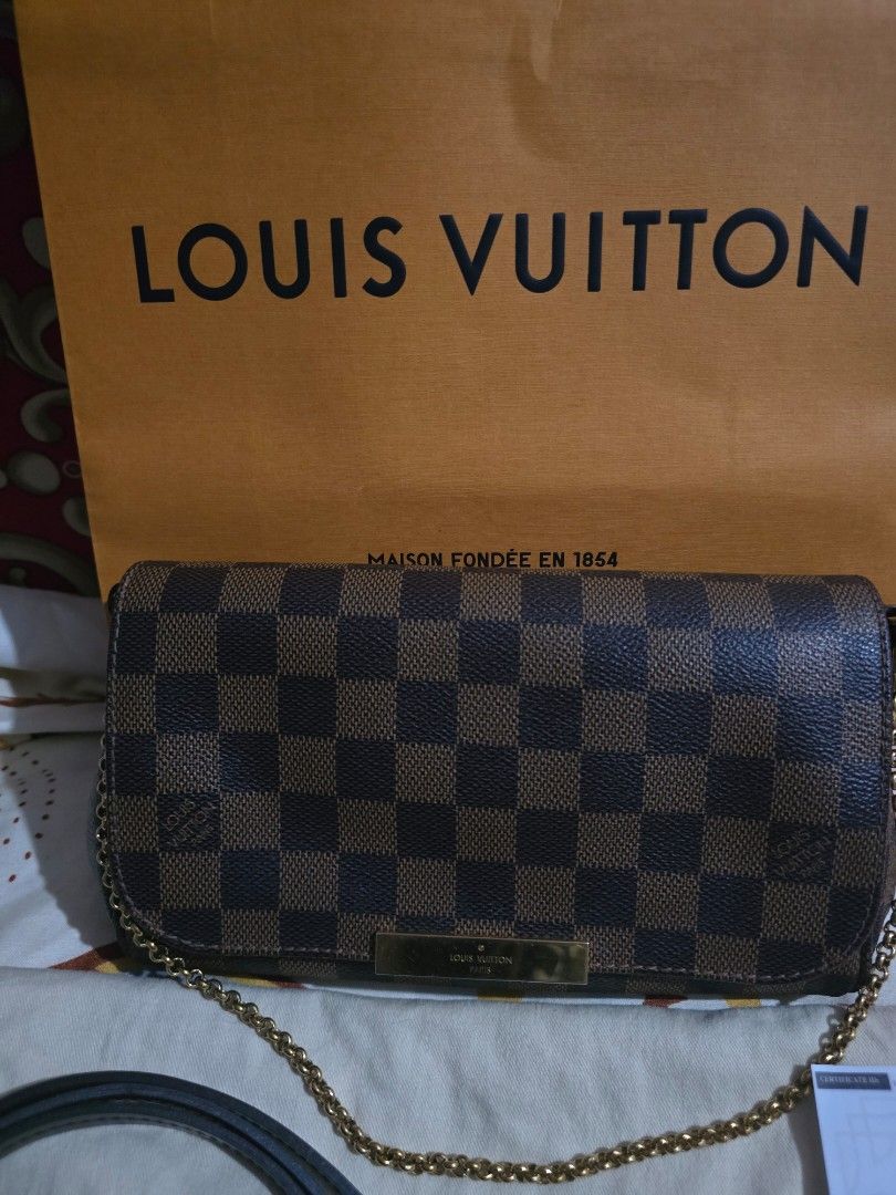 Guaranteed original LV damier favorite PM (Category: Luxury Bags & Wallets) located in Manila. Submitted by jels17120523 (Listing ID 1367832598, Image 2). Description: Guaranteed original lv damier favorite PM size comes with dustbag, paper bag, 2 straps and luxe paragon certificate. some hairlines on the plate. no rubs and open piping. In excellent condition. money back guaranteed if proven fake by a legit authenticator..