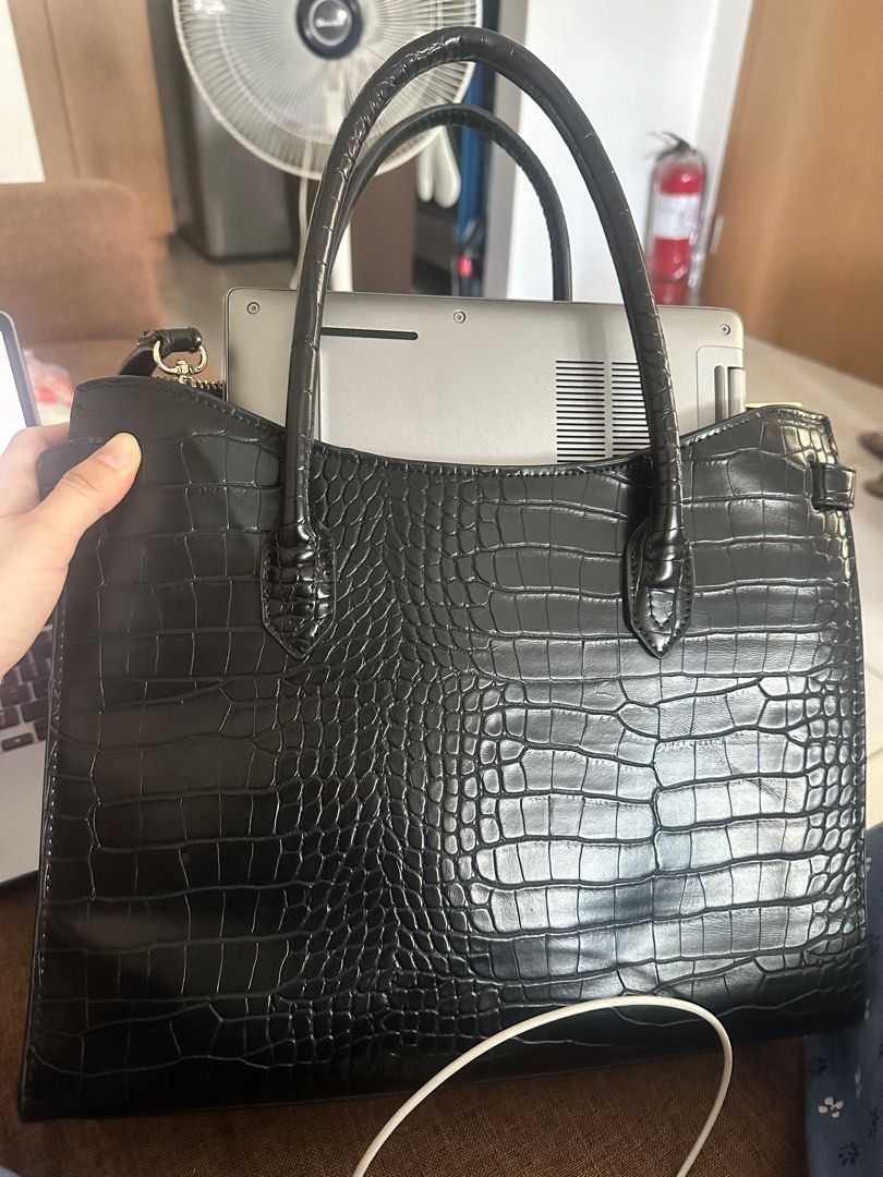 Mango croc effect leather black bag 2-way (Category: Luxury Bags & Wallets) located in Taguig. Submitted by jennifer_sells (Listing ID 1367131859, Image 1). Description: Rfs: di po nagagamit (wfh) Used once or twice lang Great office bag (spacious) 2-way (shoulder bag, cross body) No lowballers Buyer to arrange pick up Could fit a laptop.