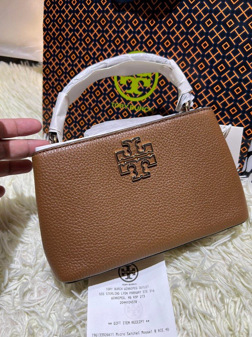 Tory burch mini britten top handle (Category: Luxury Bags & Wallets) located in Calamba. Submitted by biyanggg (Listing ID 1367744490, Image 1). Description: Plus sf Complete incl.