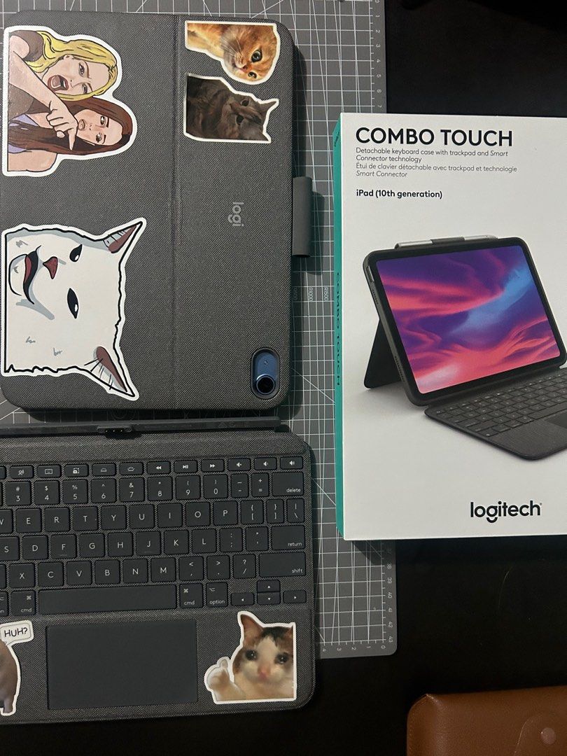 Ipad case Logitech Combo Touch Detachable Keyboard and Trackpad (Category: Cases & Sleeves) located in Quezon City. Submitted by dicgrayson (Listing ID 1367974177, Image 1). Description: Logitech Combo Touch Keyboard with Trackpad. Used for less than 1 year. Cons: Has cat memes and stickers from different countries .