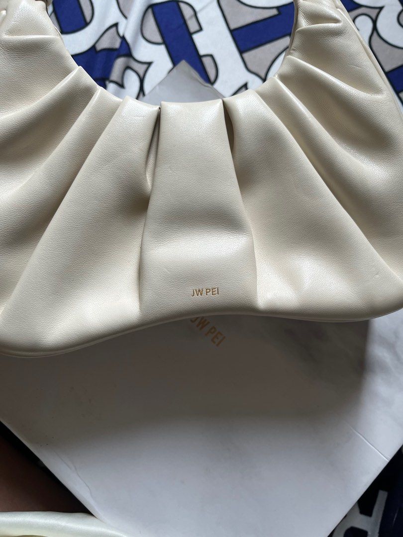 JW Pei Gabbi (Category: Purses & Pouches) located in Manila. Submitted by coffeeandcodals (Listing ID 1367921831, Image 1). Description: ‼️Free when you buy items from my listing with a total amount of 500 🤍Used less than 5 times kaso na-stock siya nung pandemic sa cabinet 🥲 Caused peeling off ng leather sa handle part ‼️With dustbag and box ‼️This is the first version hence diff packaging compared sa green ‼️Issues: Peel off ng leather sa hand
