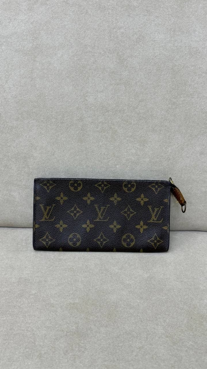 Louis Vuitton Bucket Pouch in Monogram (Local Stock*) (Category: Bags & Wallets) located in Singapore. Submitted by projectlfg (Listing ID 1367891492, Image 3). Description: Louis Vuitton Bucket Pouch in Monogram (Local Stock*) Condition 97% New. Year: - Accessories: - Note: Interior suede discolouration due to age* Size: 19.5x10x1.5 / SGD: 170 • ACRA Registered Company in Singapore • Physical Outlets in Singapore and China • Entrupy Verified Bus