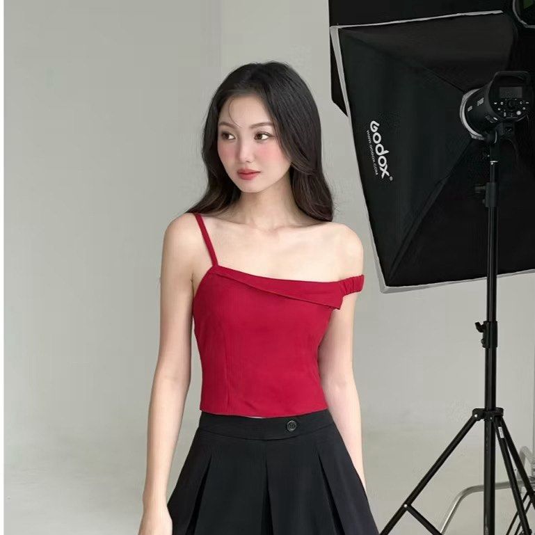 Red off-shoulder assymetrical top (Category: Sleeveless) located in Quezon City. Submitted by declutterwjjj (Listing ID 1367972147, Image 1). Description: Brand new with tag. From a Vietnamese brand called mifworkshop on ig! Looks really good and pretty in actual just big on me :( Size S, size chart posted. Retails 896 on 🍊app selling low. .