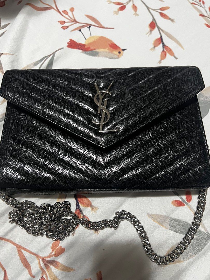 YSL (authentic WOC) (Category: Luxury Bags & Wallets) located in Mandaluyong City. Submitted by richelle_22 (Listing ID 1367952149, Image 1). Description: Authentic; with flaws inside (see pics); outside is in good condition; selling low.