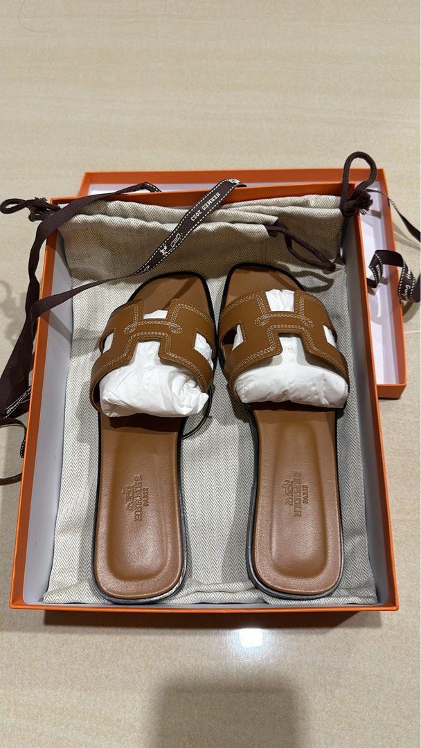Authentic Hermes Oran Sandals Gold (Category: Sneakers & Footwear) located in Quezon City. Submitted by breakmyfashion (Listing ID 1368152526, Image 1). Description: Comes in full set with receipt, box, paperbag and dust bag. .