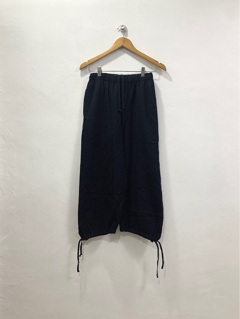COMME des GARÇONS COMME des GARÇONS AD2005 TIE CUFF PANTS (Category: Other Bottoms) located in Cavite. Submitted by ___layern0ne (Listing ID 1368194846, Image 1). Description: Tagged Size: S Waistline: 23-34 (adjustable) Front Rise: 11.5 inches Leg Opening: 8 inches (adjustable) Length: 34.5 inches Measured laid flat and to its longest point | Stretchable material Wrinkled due to long storage | Requires light ironing to take the wrinkles out Bare