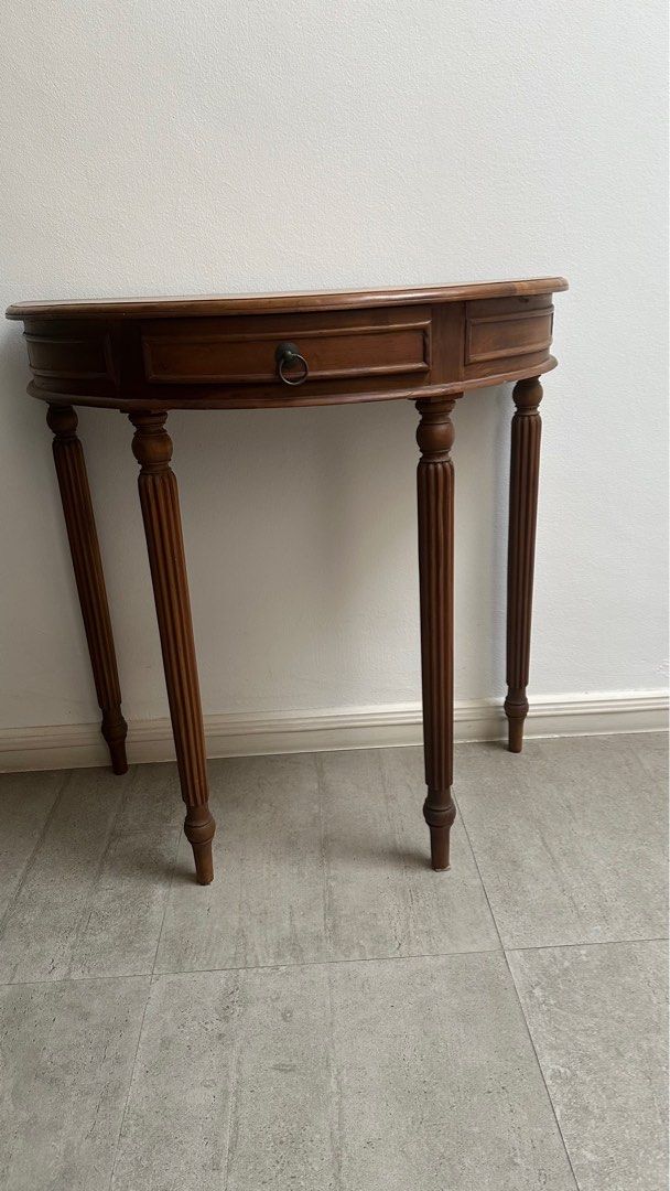 Console table (Category: Shelves, Cabinets & Racks) located in Singapore. Submitted by audslw (Listing ID 1368106128, Image 1). Description: Crescent shape console - 80cm x 40 cm. .