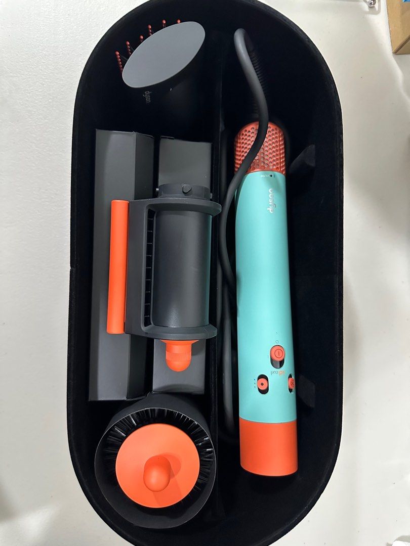 Dyson Airwrap i.d. (Category: Hair) located in Quezon City. Submitted by h.eart (Listing ID 1368063386, Image 2). Description: -Bought in Dyson Greenbelt -Dyson Airwrap i.d.™ multi-styler and dryer Straight+Wavy in Ceramic patina and topaz -Original Price: ₱36,900 -All functions work perfectly and it has been used with care. -Comes with the included attachments and storage case -Minor signs of use is present on the orange-colored top section of t