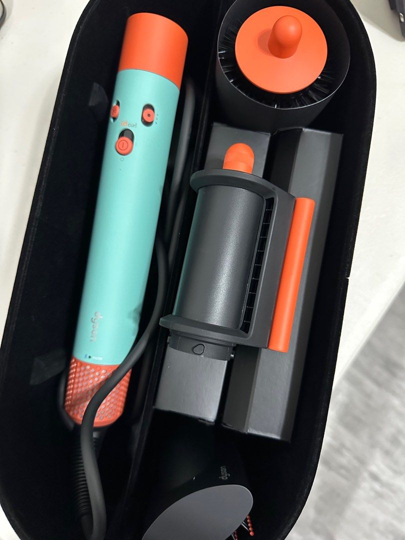 Dyson Airwrap i.d. (Category: Hair) located in Quezon City. Submitted by h.eart (Listing ID 1368063386, Image 1). Description: -Bought in Dyson Greenbelt -Dyson Airwrap i.d.™ multi-styler and dryer Straight+Wavy in Ceramic patina and topaz -Original Price: ₱36,900 -All functions work perfectly and it has been used with care. -Comes with the included attachments and storage case -Minor signs of use is present on the orange-colored top section of t