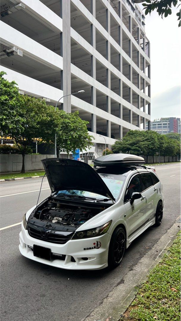 Honda Stream 1.8 (A) (Category: Used Cars) located in Singapore. Submitted by GoodSalesDepartment (Listing ID 1365659368, Image 2). Description: Super Good Condition Honda Stream RN6 with MUGEN Bodykit. Replaced most of the parts. Engine and gearbox gasket all replaced. Wear and tear all replaced. Engine mounting all replaced. Spark plug all replaced and ignition coil. BC coilover. New IU. CF steering wheel. CF bonnet. Android player. Unique Cent