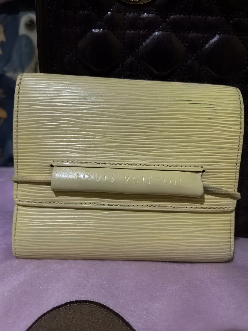LOUIS Vuitton epi leather wallet (Category: Luxury Bags & Wallets) located in Quezon City. Submitted by uptrendglam (Listing ID 1368172150, Image 1). Description: Louis Vuitton epi leather wallet, garter closure, 7 bills slots & a coin slot. Light Yellow in color, guaranteed authentic.