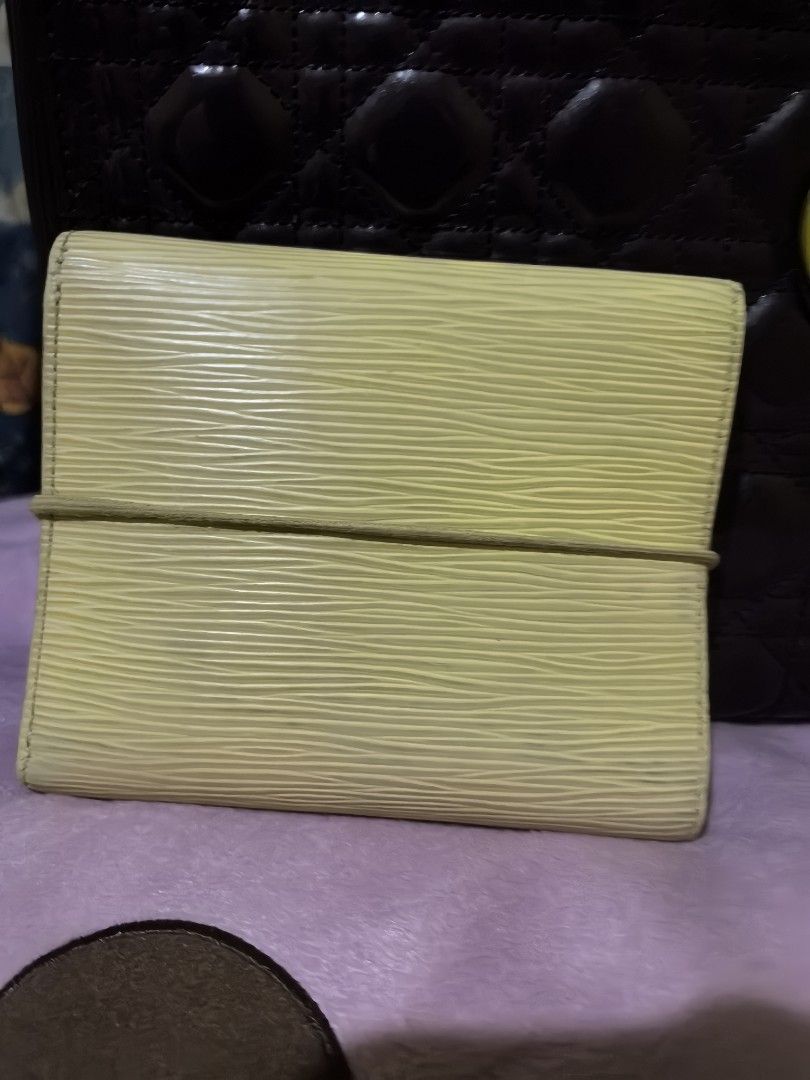 LOUIS Vuitton epi leather wallet (Category: Luxury Bags & Wallets) located in Quezon City. Submitted by uptrendglam (Listing ID 1368172150, Image 2). Description: Louis Vuitton epi leather wallet, garter closure, 7 bills slots & a coin slot. Light Yellow in color, guaranteed authentic.