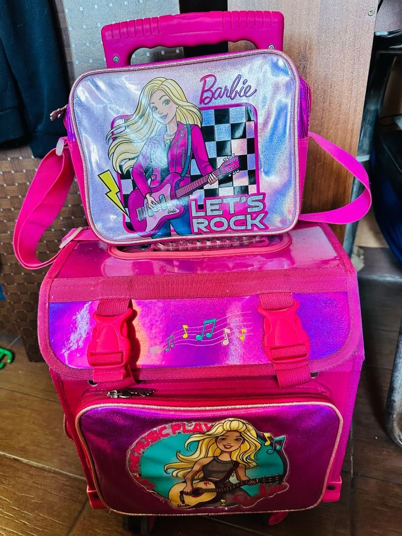 Original Barbie Stroller Bag (Category: Strollers) located in Taguig. Submitted by ian_76ers (Listing ID 1368169277, Image 1). Description: Original Barbie Stroller bag with Lunch box and cover. Used only in school year 2023-24 in her kindergarten days.