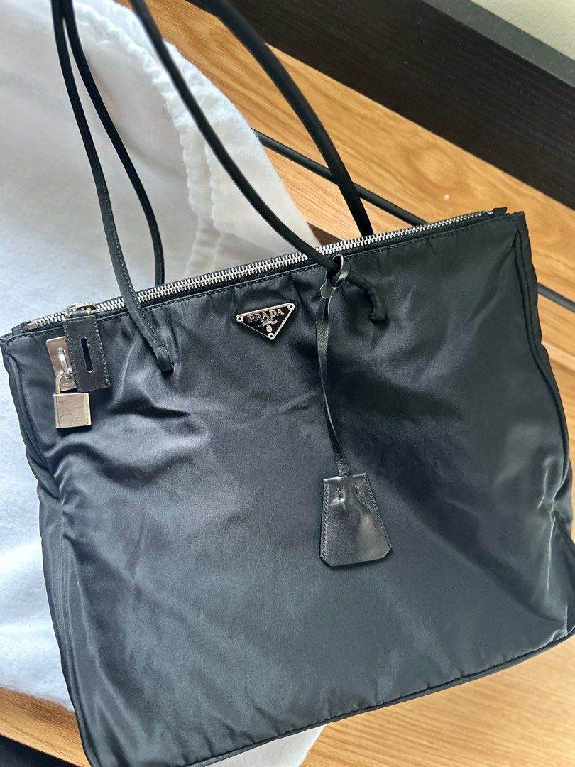 Prada Totebag with lock & key (Category: Luxury Bags & Wallets) located in Davao. Submitted by fleasandfindsdvo (Listing ID 1368184765, Image 1). Description: 💯 Authentic ✅ CASH/GCASH/BANK TRANSFER ✅ Layaway for 1-2 months (with %interest) ✅ With dustbag ✅ No smell, no holes, no scratch ⚠️ This is a preloved item, please manage your expectations. What you see is what you get. ⚠️ Actual photo posted, no editing of lights or adjustments on photo. 
