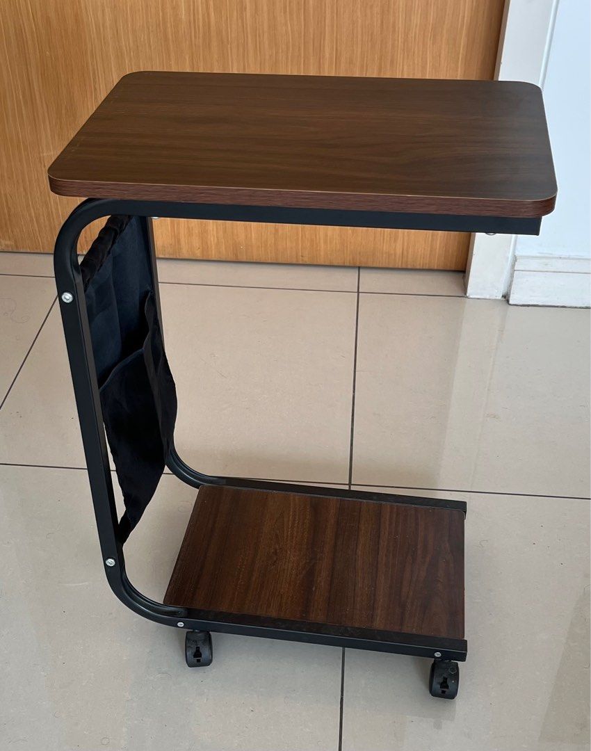 Side Table (Category: Tables & Sets) located in Kuala Lumpur. Submitted by neenawork68621 (Listing ID 1368088081, Image 1). Description: Colour - Dark Brown Movable with brake wheels and a pocket. PS: Original pocket has been replaced with a stronger satin pocket of the same size and style. Discount on the total amount if buying both. .
