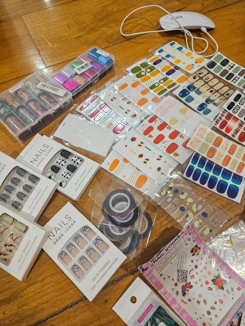 Assorted Nail Stickers and Nail Art Materials (Category: Hands & Nails) located in Quezon City. Submitted by summ_time (Listing ID 1372409427, Image 1). Description: Selling as is! Assorted nail art materials 1. Nail art stickers 2. Water decals 3. Press-on nails (no nail glue) 4. Nail art foils 5. LED lamp for gel manicures 6. Striping tape Please note that the nail stickers and foils have been partially used.