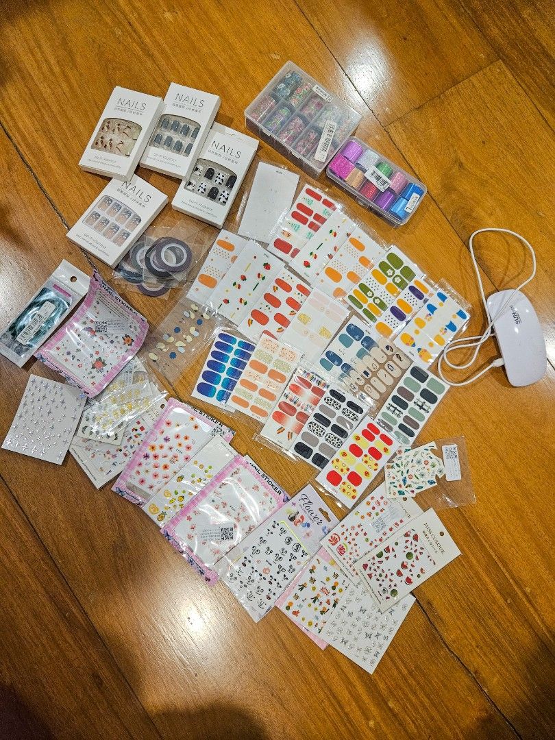 Assorted Nail Stickers and Nail Art Materials (Category: Hands & Nails) located in Quezon City. Submitted by summ_time (Listing ID 1372409427, Image 2). Description: Selling as is! Assorted nail art materials 1. Nail art stickers 2. Water decals 3. Press-on nails (no nail glue) 4. Nail art foils 5. LED lamp for gel manicures 6. Striping tape Please note that the nail stickers and foils have been partially used.