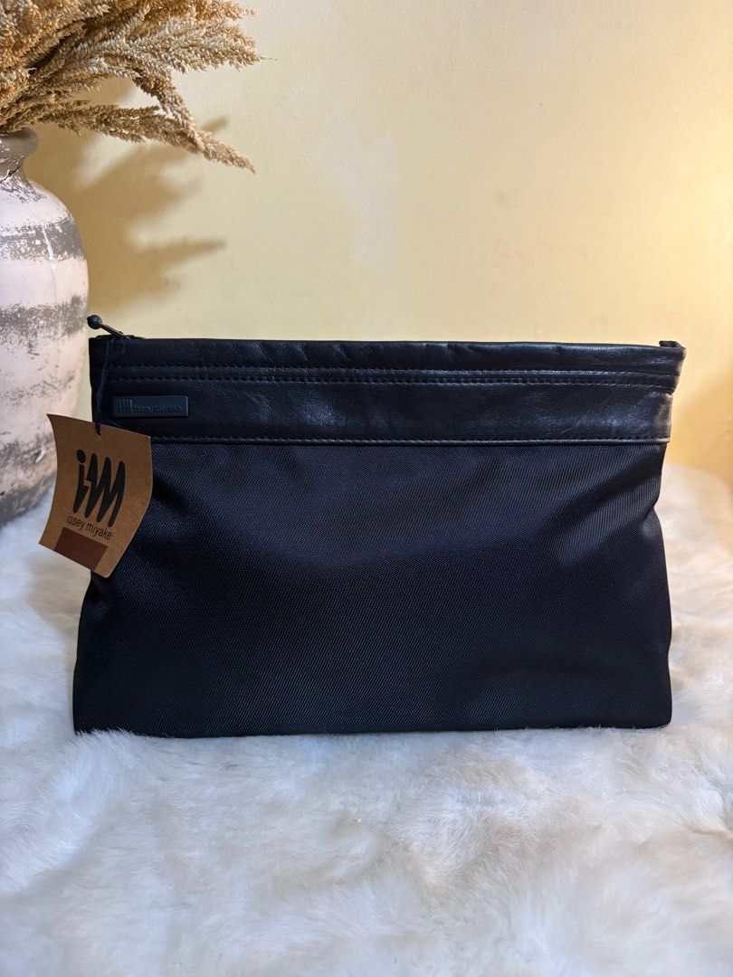 Authentic Issey Miyake Black Clutch Bag (Category: Luxury Bags & Wallets) located in Binangonan. Submitted by makoleksyon (Listing ID 1372279530, Image 2). Description: Brand new With tag No flaws Bought in Japan 💯% Authentic Money back guarantee .