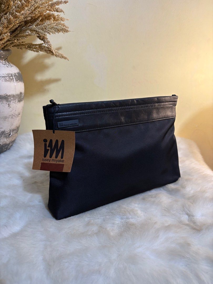 Authentic Issey Miyake Black Clutch Bag (Category: Luxury Bags & Wallets) located in Binangonan. Submitted by makoleksyon (Listing ID 1372279530, Image 1). Description: Brand new With tag No flaws Bought in Japan 💯% Authentic Money back guarantee .