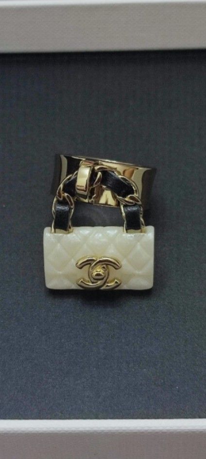 CHANEL COCO Mark Matelasse Ring (Category: Luxury Accessories) located in Caloocan City. Submitted by babe.mine (Listing ID 1369226093, Image 1). Description: Can be used as Pendant, Bracelet Charm, Bag Charm From the Cruise 2023 Collection by Virginie Viard Gold-Plated Resin & Leather Accessories: None Without box, case, dust bag or other accessories. Only the main unit will be shipped..