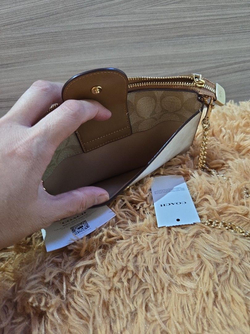 Coach Sling Bag and small pouch (Category: Bags & Wallets) located in Singapore. Submitted by jethrocarino123-82219 (Listing ID 1372468855, Image 3). Description: Brandnew and authentic my hubby bought in US when he visit her sister in newjersey..