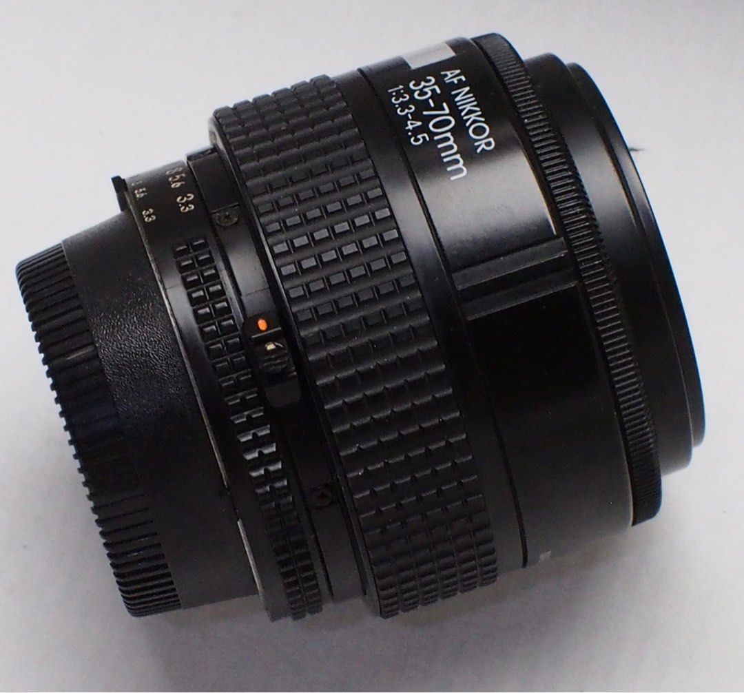 Nikon Nikkor lens 35-70f3.3 (Category: Lens & Kits) located in Las Pinas. Submitted by film101 (Listing ID 1372407886, Image 2). Description: Nikon AF nikkor 35-70 f3.3-4.5 Made in JAPAN Best on this lens Can do manually arrange the aperture and manual focusing CLEAN OPTICS nO haze Aperture snaps Focusing smooth Take note ;kindly take a reserch bout this LENS for AF functions in your camera .