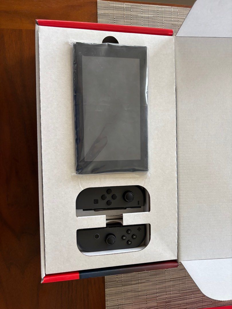 Nintendo Switch V1 (Category: Nintendo) located in Lipa City. Submitted by exumos (Listing ID 1372336037, Image 2). Description: Nintendo Switch V1 PRICE FIRM Inclusions: > Switch (Good Condition, working perfectly and taken care of) > OG black joycons (has stick drift) > Purple & Yellow Joycon (Brand new, no stick drift, pristine and inspected only; ₱3500 retail price) > Dock w/ HDMI cord > Joycon Straps for Purple & Yellow controllers only > Sw