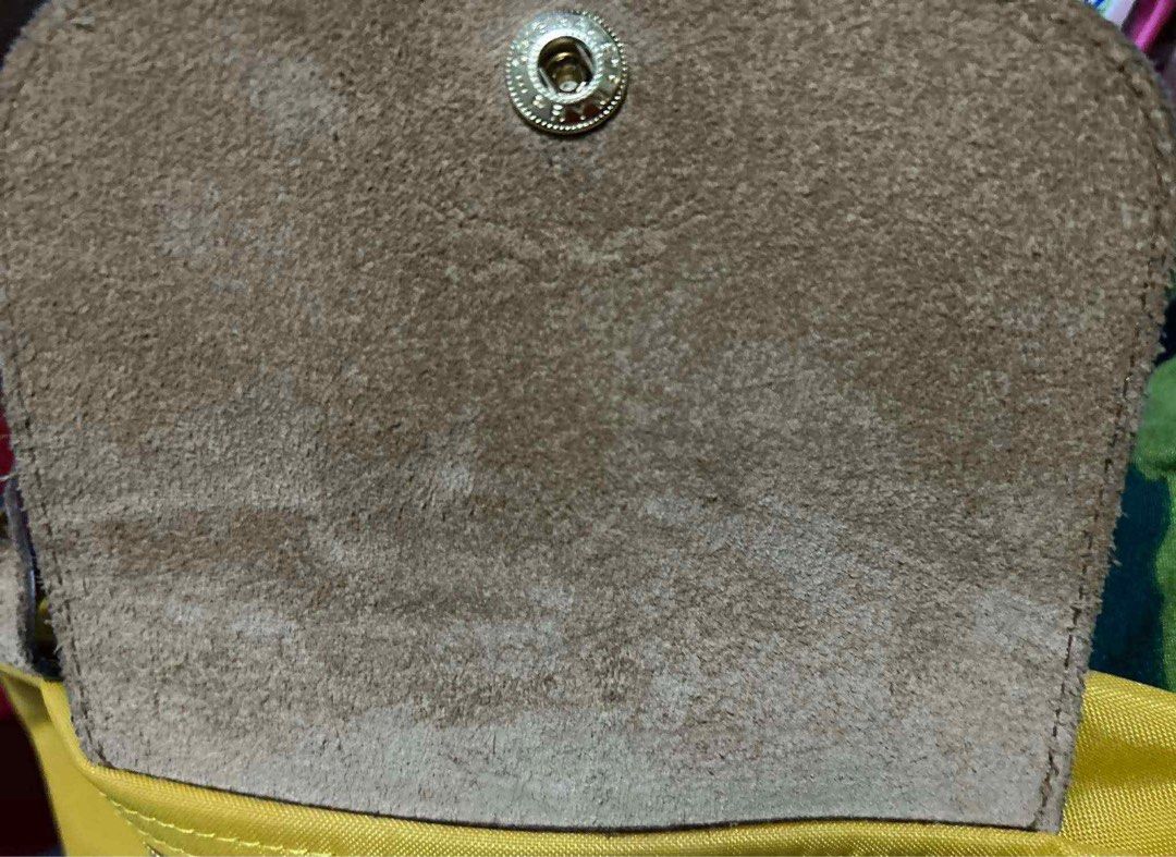 Authentic Longchamp Le Pliage Yellow Large (Category: Luxury Bags & Wallets) located in Quezon City. Submitted by forthriftersph (Listing ID 1374030305, Image 3). Description: Authentic Longchamp Le Pliage Yellow Large Preloved Details: Material: Canvas, Polyamide fabric with a minimum of 70% recycled fiber, with interior coating Finish accessories: Gold color Russian leather (Cowhide) Color: Yellow Dimension: H 30cm x L 31cm x W 19cm Net weight: