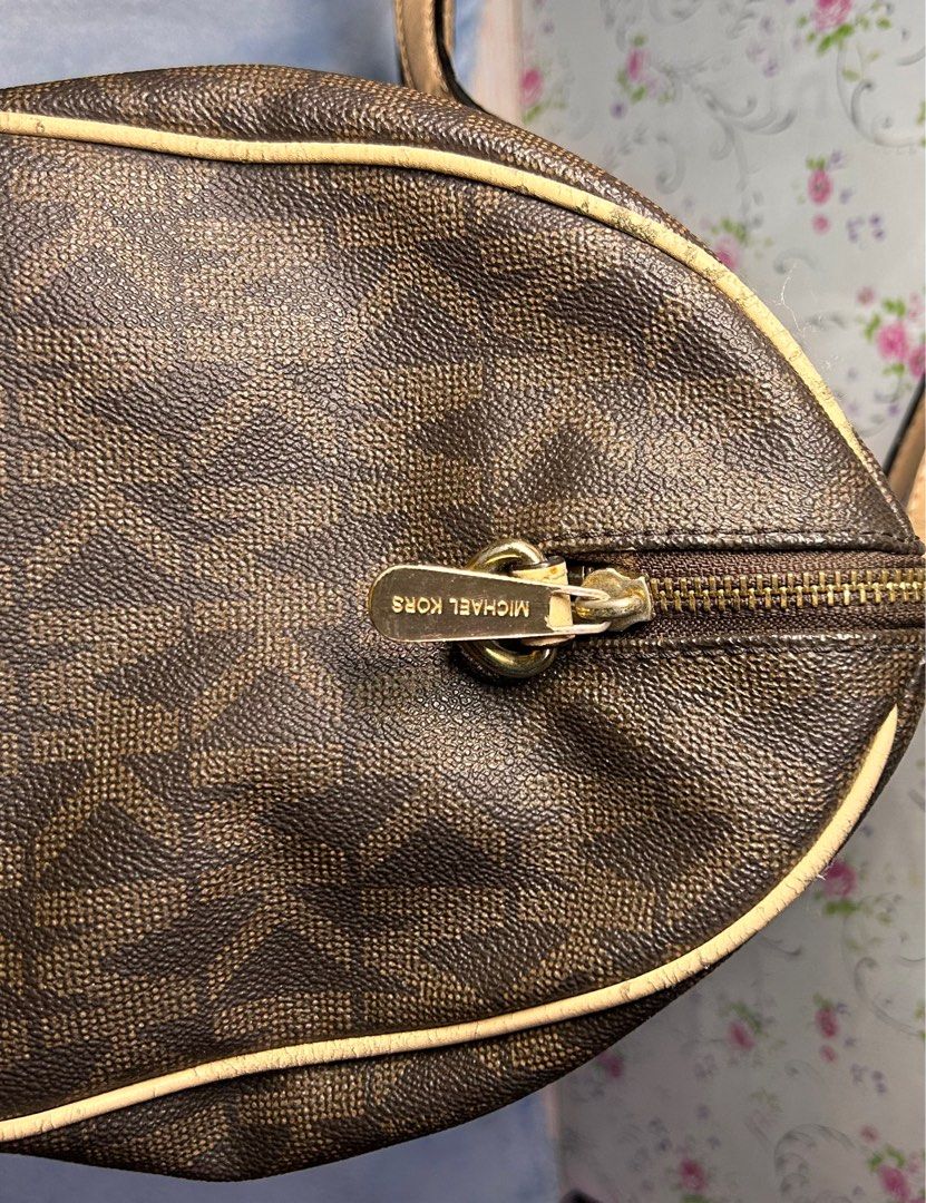 Authentic Michael Kors Grayson Monogram Duffle Satchel (Category: Luxury Bags & Wallets) located in Manila. Submitted by nica.ang (Listing ID 1373964738, Image 2). Description: Please read: Authentic, bought in the US. Missing emblem Scratches on hardware Chips on the leather piping and handle. Madumi inside. Overall, still in ok condition. Makapal parin leather. First to pay Gcash Jnt or lalamove #decluttering.