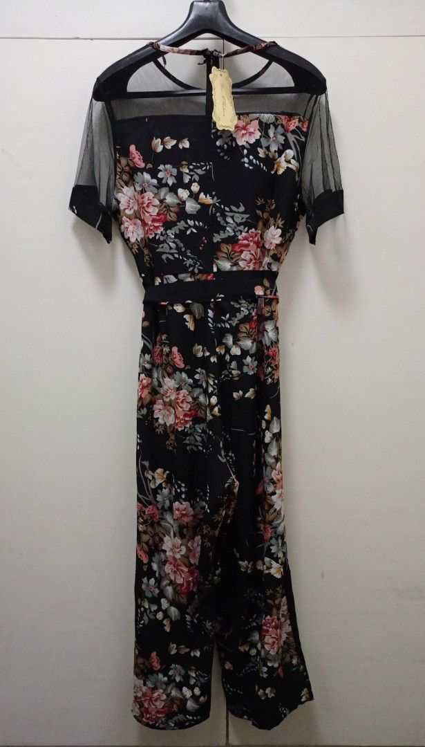 Black Floral Jumpsuit Plus+ (Category: Jumpsuits) located in Pasig City. Submitted by journashop (Listing ID 1374056944, Image 2). Description: Brand New With Tag Still Attached Soft Material With Belt Semi Spandex Fits 2XL Meas " INCHES " Neck 10 " Shoulder 18 " Bust 20 " Waist 18 " Hips 20 " Length 52 1/2 " MOP : GCASH or PayMaya.