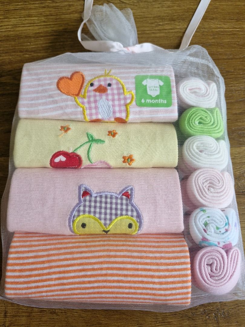 Brand New 6 months (4-Romper gift pack with 5 handkerchief) (Category: Babies & Kids Fashion) located in Singapore. Submitted by hwk1712 (Listing ID 1374014184, Image 1). Description: Brand new gift box. Self-collect at Buangkok mrt or Tanjong Pagar Mrt.