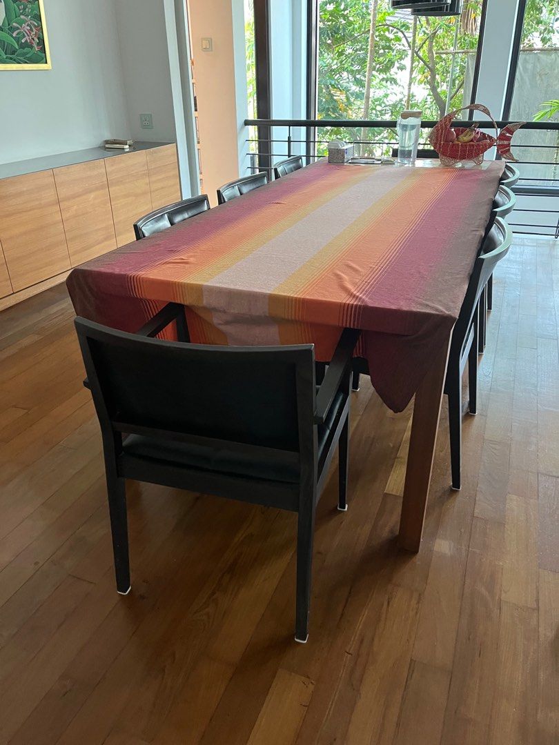 Dining Table Set (Category: Tables & Sets) located in Singapore. Submitted by pretzel8 (Listing ID 1374072637, Image 1). Description: Custom made table with 8 matching chairs that can fit 8 comfortably. 1m x 45cm. Table cannot be dismantled and was made for the house. It is always covered with a tablecloth. Leather on chairs are worn and slightly cracked but not peeling. Chairs and table can be sold separately too..